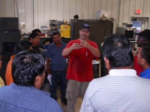 Earl Lynch, Small Equipment Tech, explains best & safe practices while working with the sewing machines.
