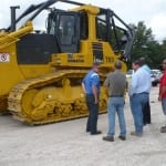 The Komatsu 275AZ dozer draws  a lot of attention from the guests.